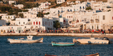 Coastline_water_boats_against_the_cityscape_of_Mykonos_island,_Cyclades,_Agean_Sea,_Greece