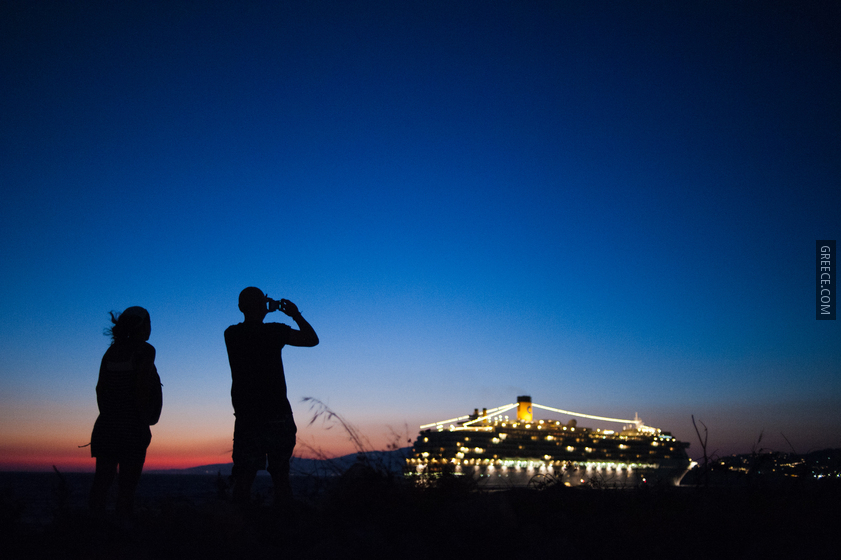 Cruise ship in the coast waters of Mykonos island Cyclades, Agean Sea, Greece