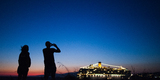 Cruise_ship_in_the_coast_waters_of_Mykonos_island._Cyclades,_Agean_Sea,_Greece