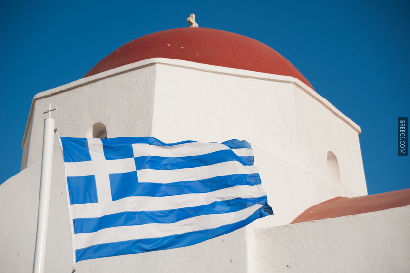 Sky bluewhite (flag of Greece) against the background of the Monastery of Panagia Tourliani Mykonos island, Cyclades, Agean Sea, Greece