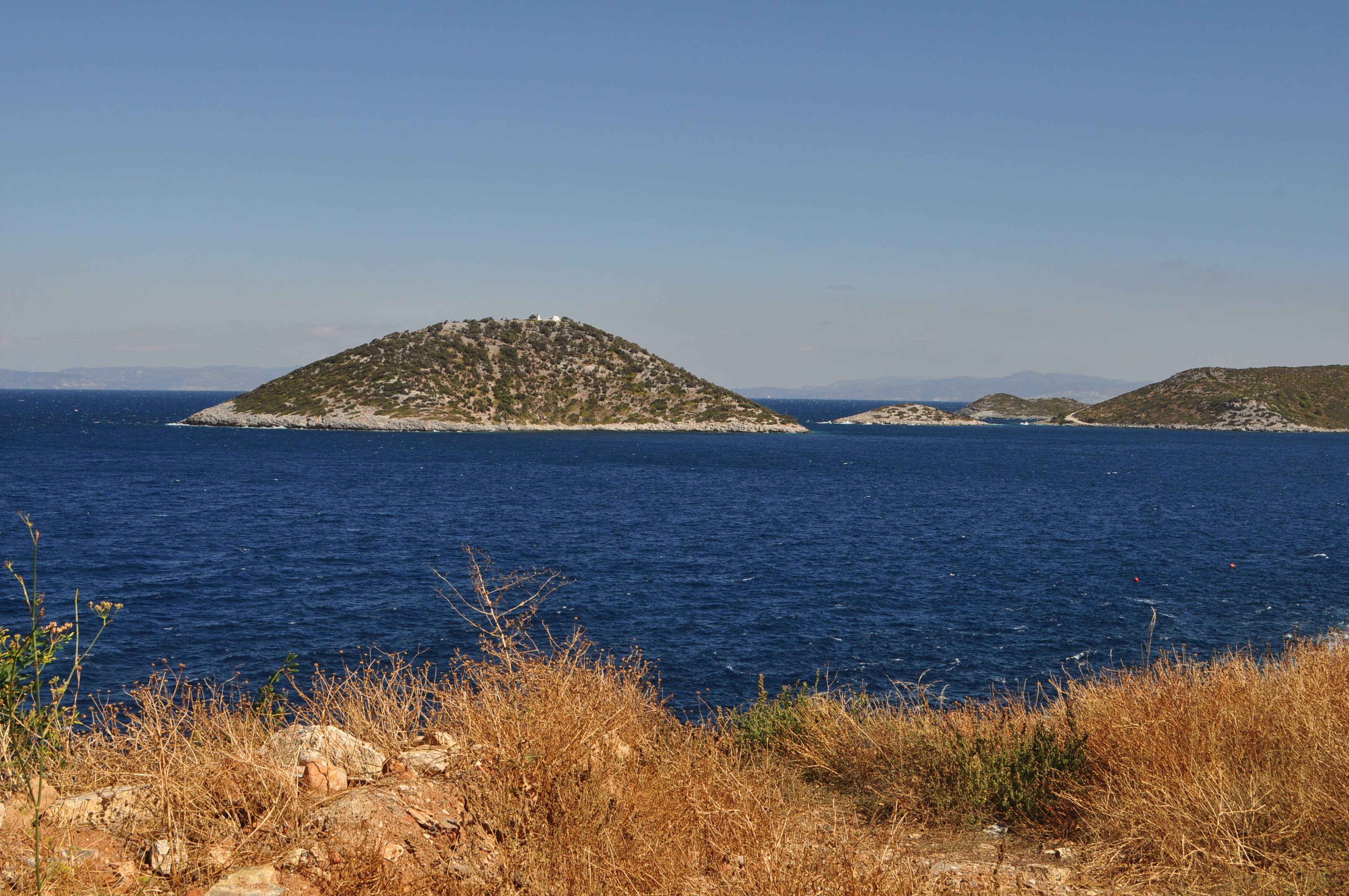 View at island Nisida Agios Nikolaos Photo from Paleokastro in Samos ...